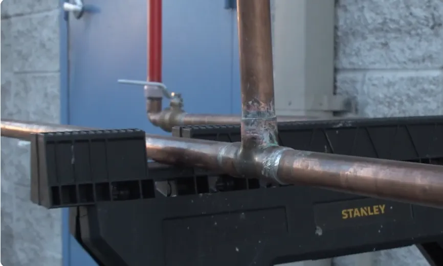 Copper pipe fittings being tested for leaks