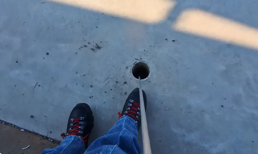 Ground probe pinpointing a slab leak on a tile floor